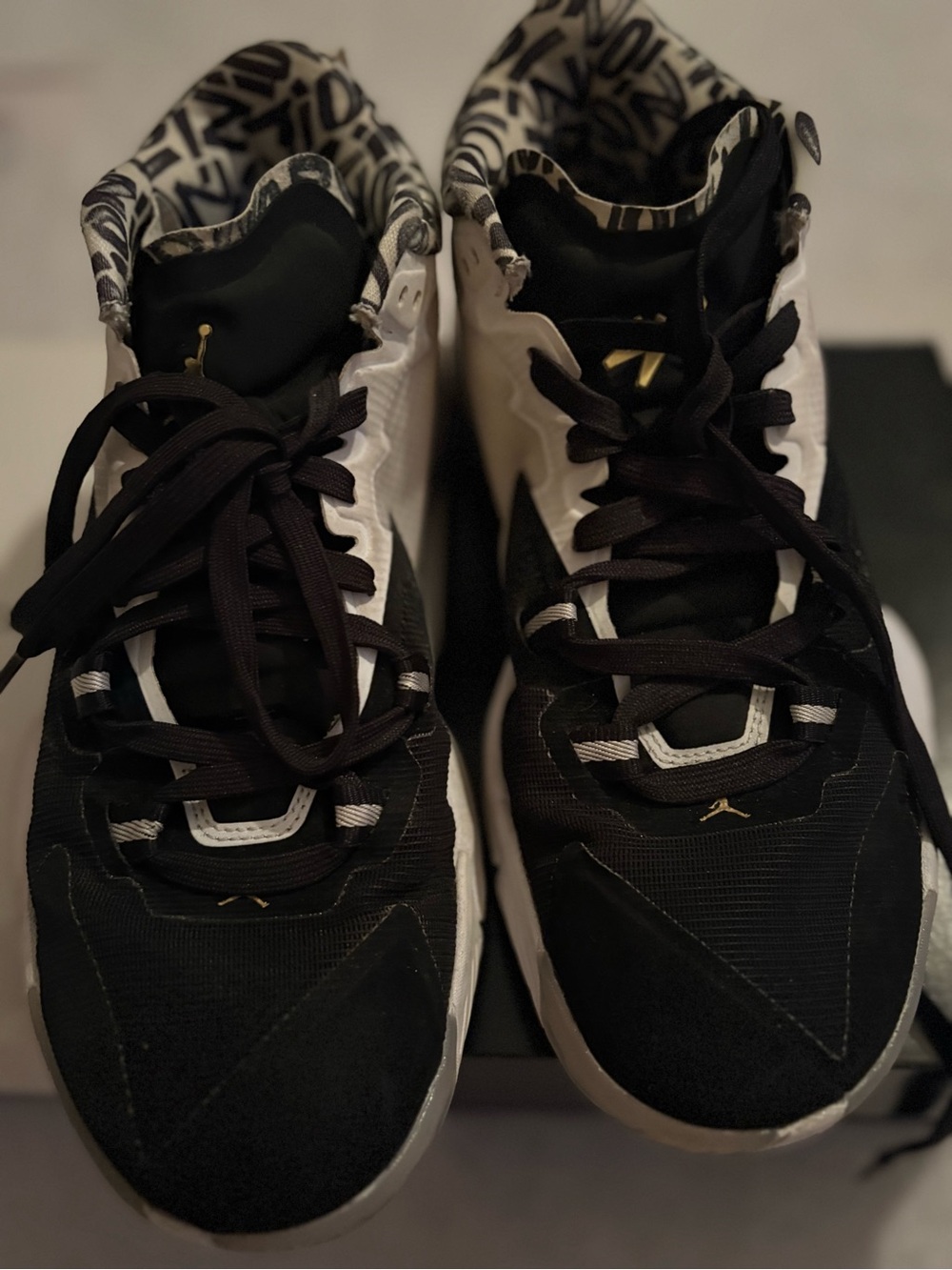 Jordan Zion 1 Black and White High-Top Sneakers with Gold Accents